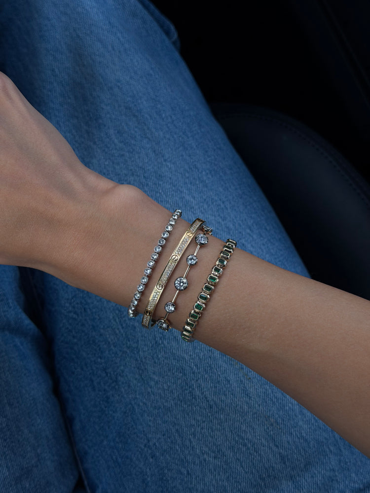 Emerald cut emerald tennis bracelet