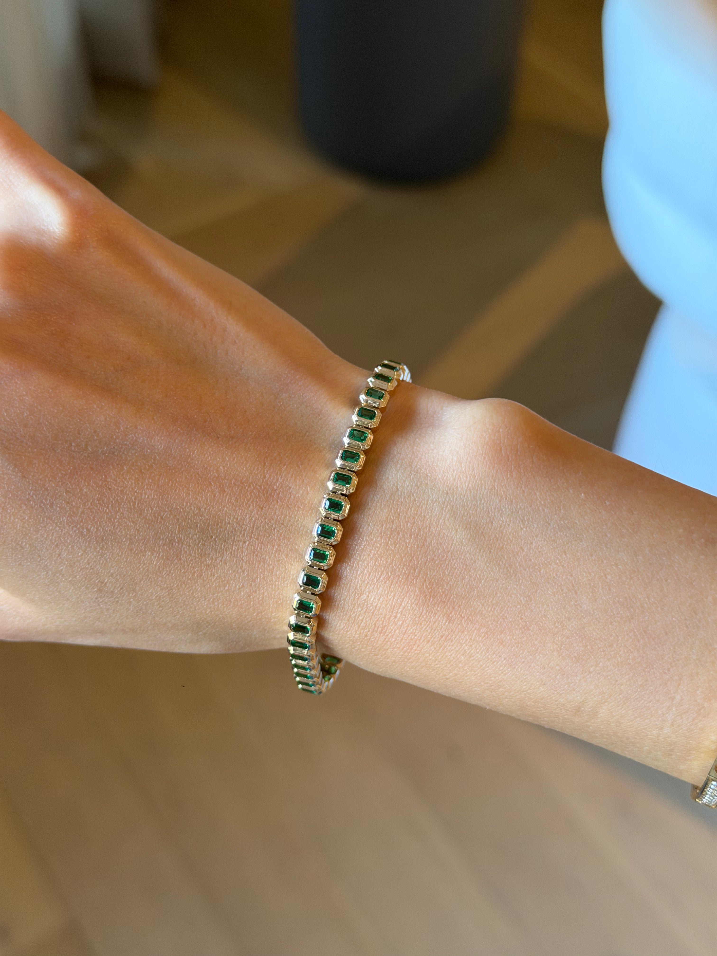 Emerald cut emerald tennis bracelet