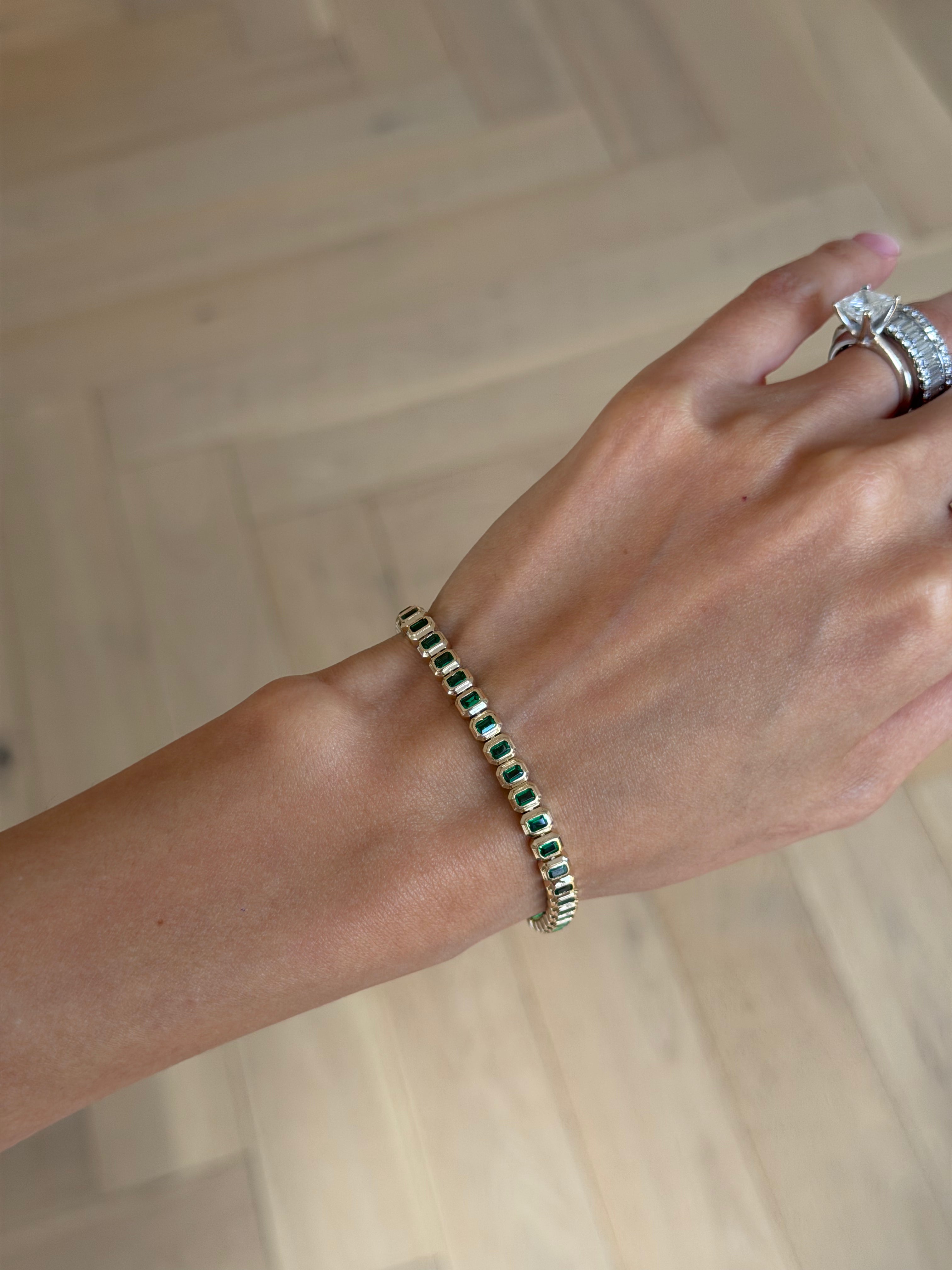 Emerald cut emerald tennis bracelet