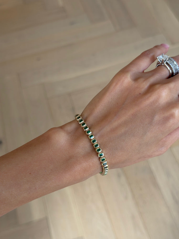 Emerald cut emerald tennis bracelet